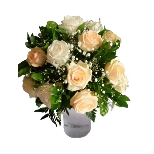 peach and white roses in a glass vase