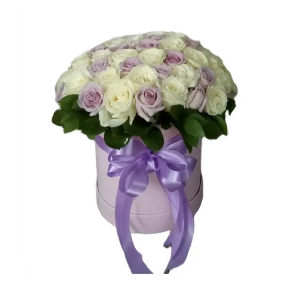 white and purple roses in a round box