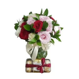 roses in a glass vase and ferrero rocher chocolate box