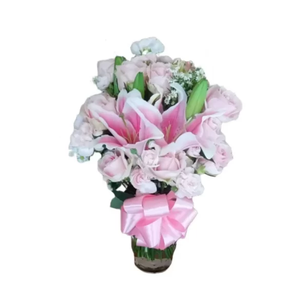 pink lilies and pink roses in a glass vase