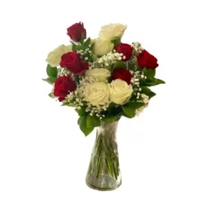 red and white roses in a glass vase